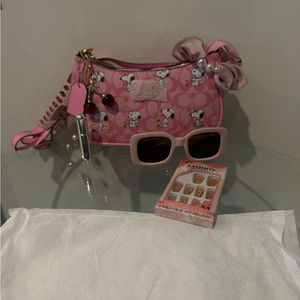 Coach Pink Kids Crossbody Bag with Snoopy Print and Bow Charm